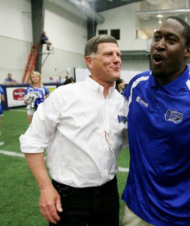 Coach Mike Parnell, left.